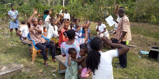 Members of the community sitting outside.