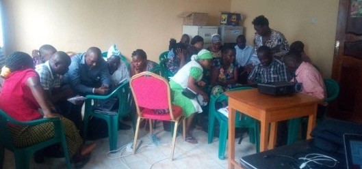 A group of people sitting in a room.